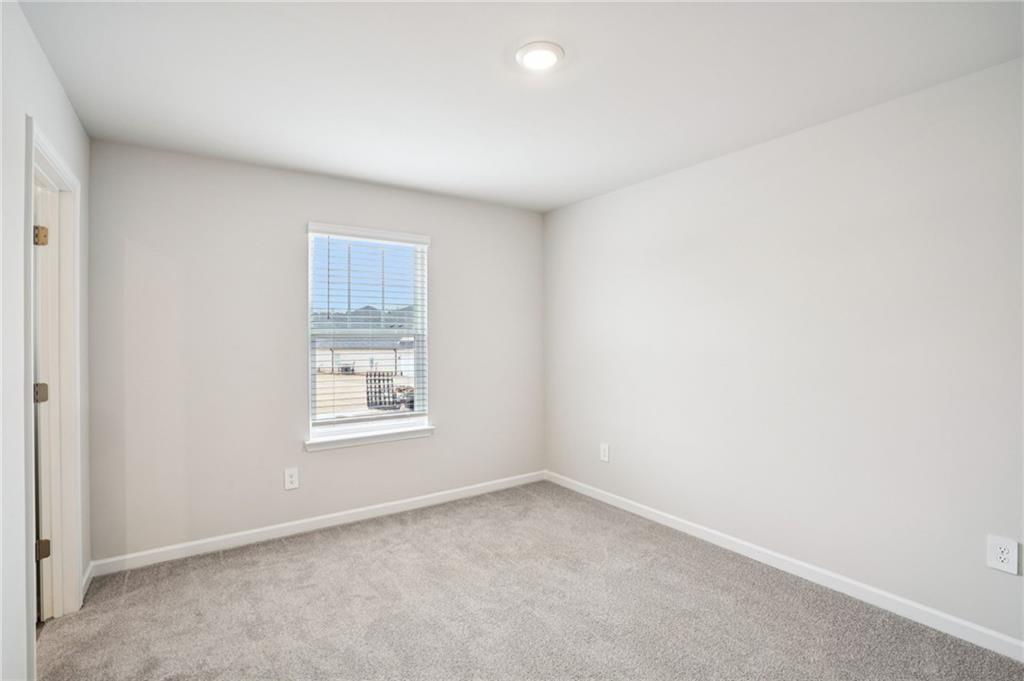 6939 Winchester Place Fairburn, GA 30213 - Photo 37 of 56 an empty room with a window