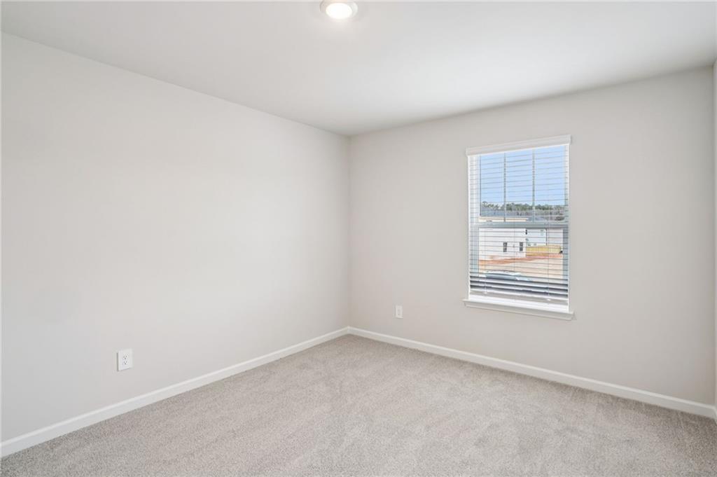 6939 Winchester Place Fairburn, GA 30213 - Photo 40 of 56 an empty room with a window