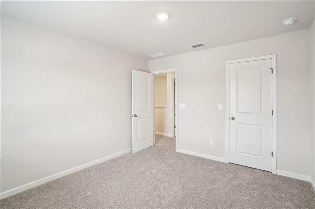 6939 Winchester Place Fairburn, GA 30213 - Photo 41 of 56 a view of an empty room
