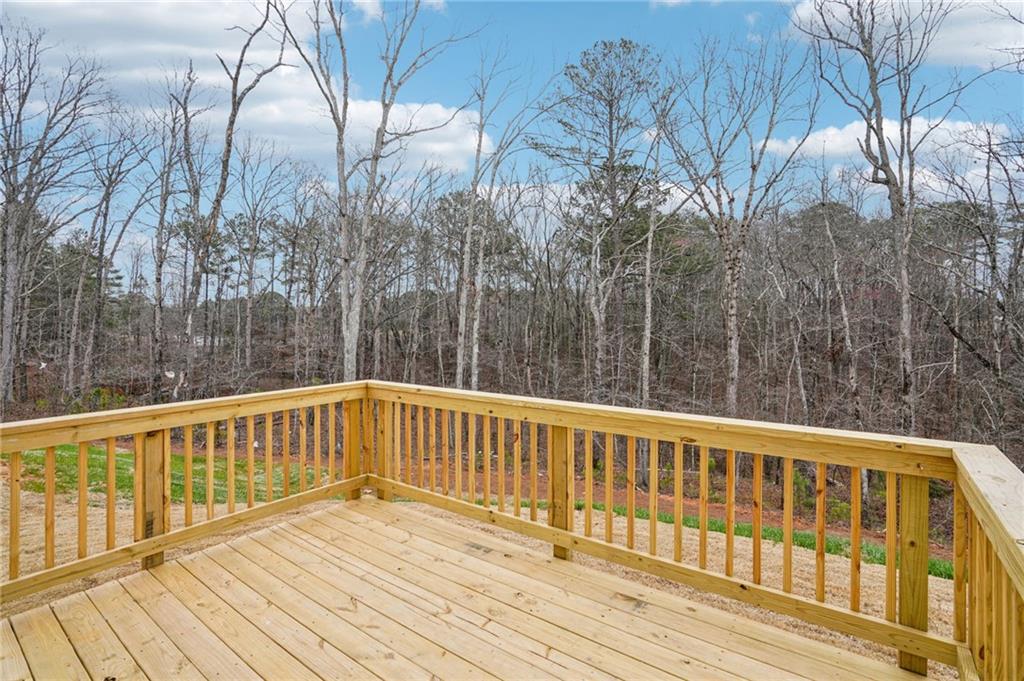 6939 Winchester Place Fairburn, GA 30213 - Photo 51 of 56 a view of balcony with wooden floor and fence