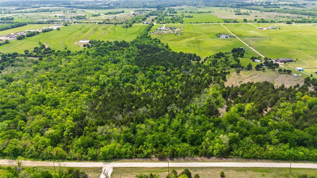 4511 County Road 4511 Commerce, TX 75428 - Photo 24 of 37 a view of a yard with an outdoor space