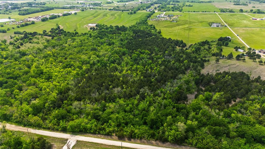 4511 County Road 4511 Commerce, TX 75428 - Photo 25 of 37 a view of a yard with an outdoor space