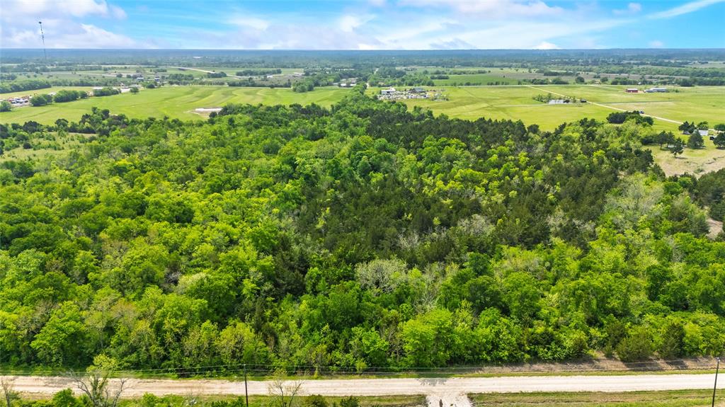 4511 County Road 4511 Commerce, TX 75428 - Photo 27 of 37 a view of an outdoor space and a yard