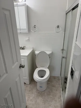 a bathroom with a toilet and a sink