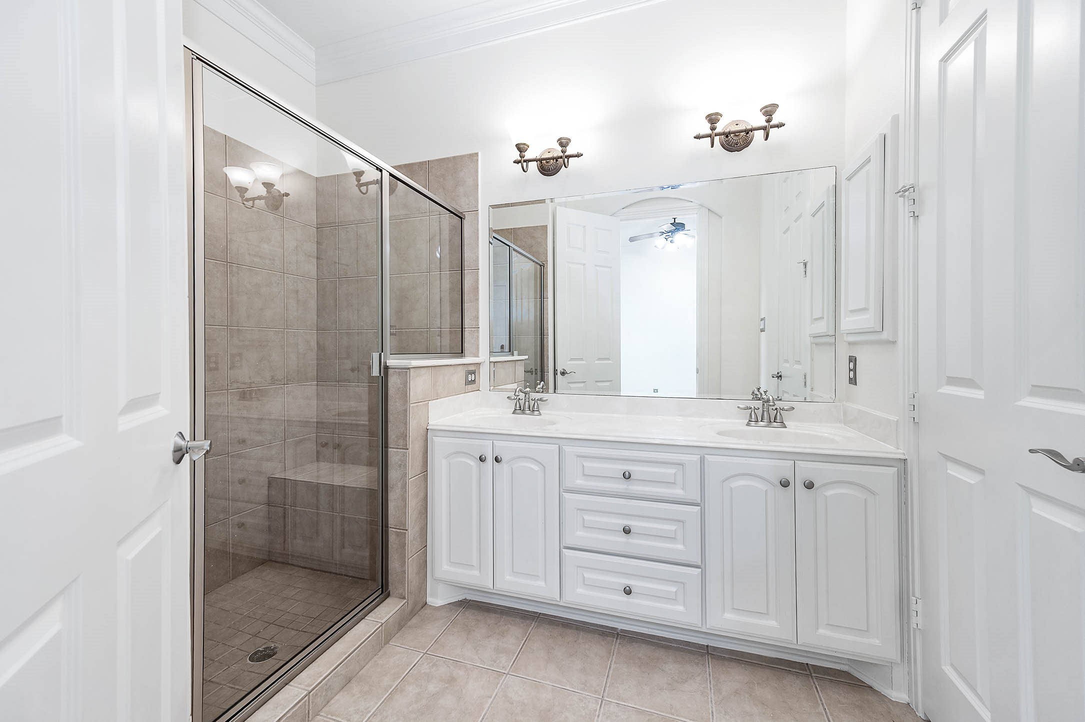 3323 Louvre Lane Houston, TX 77082 - Photo 14 of 50 a bathroom with double sink and a mirror