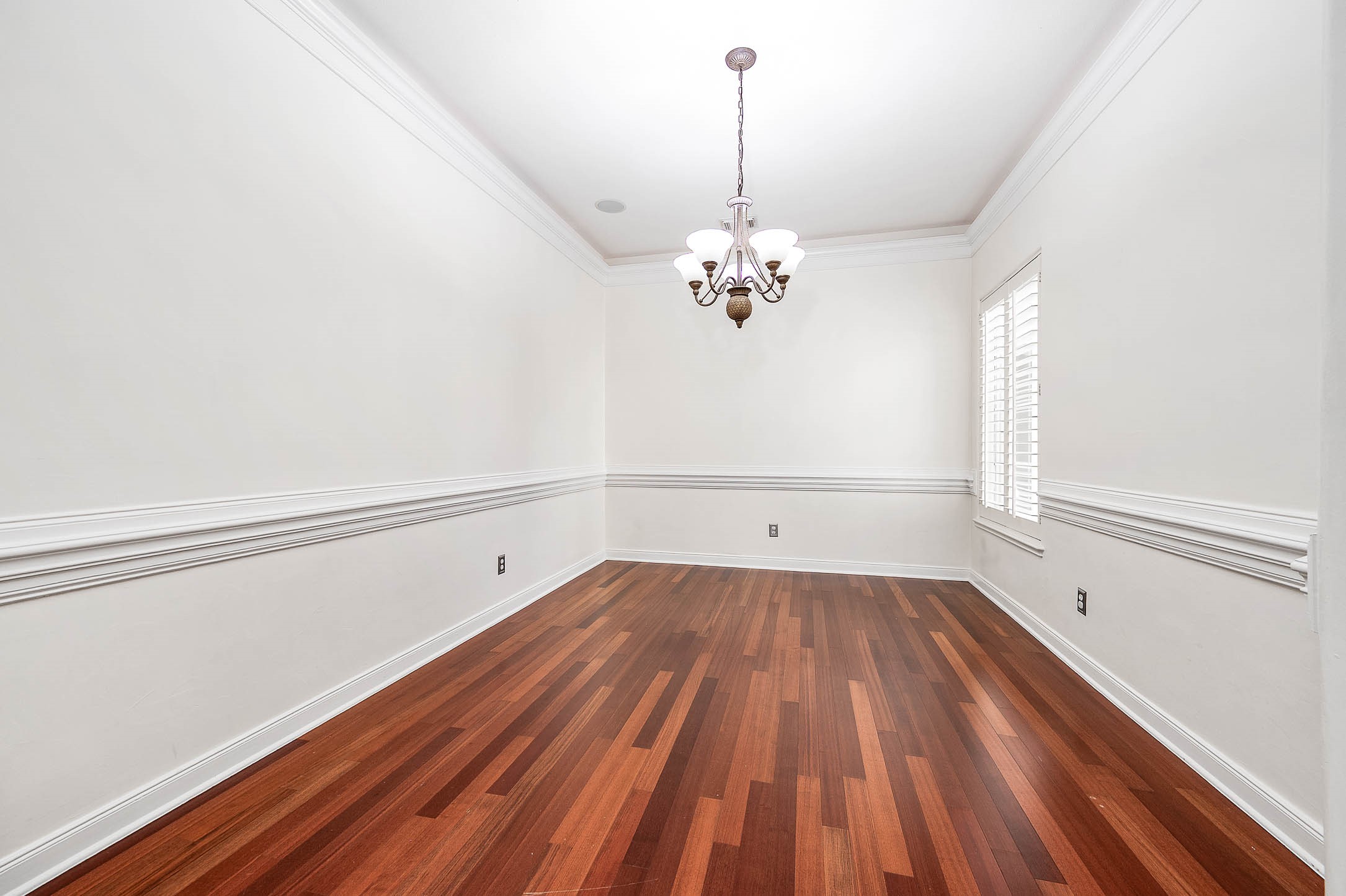 3323 Louvre Lane Houston, TX 77082 - Photo 18 of 50 a view of a room with wooden floor and fan