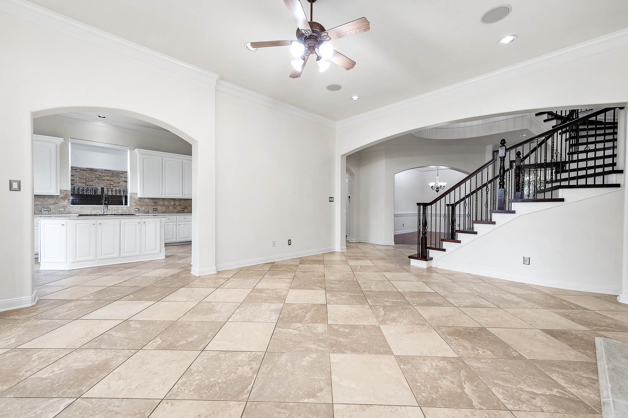 3323 Louvre Lane Houston, TX 77082 - Photo 21 of 50 a view of a kitchen with a sink and a kitchen island