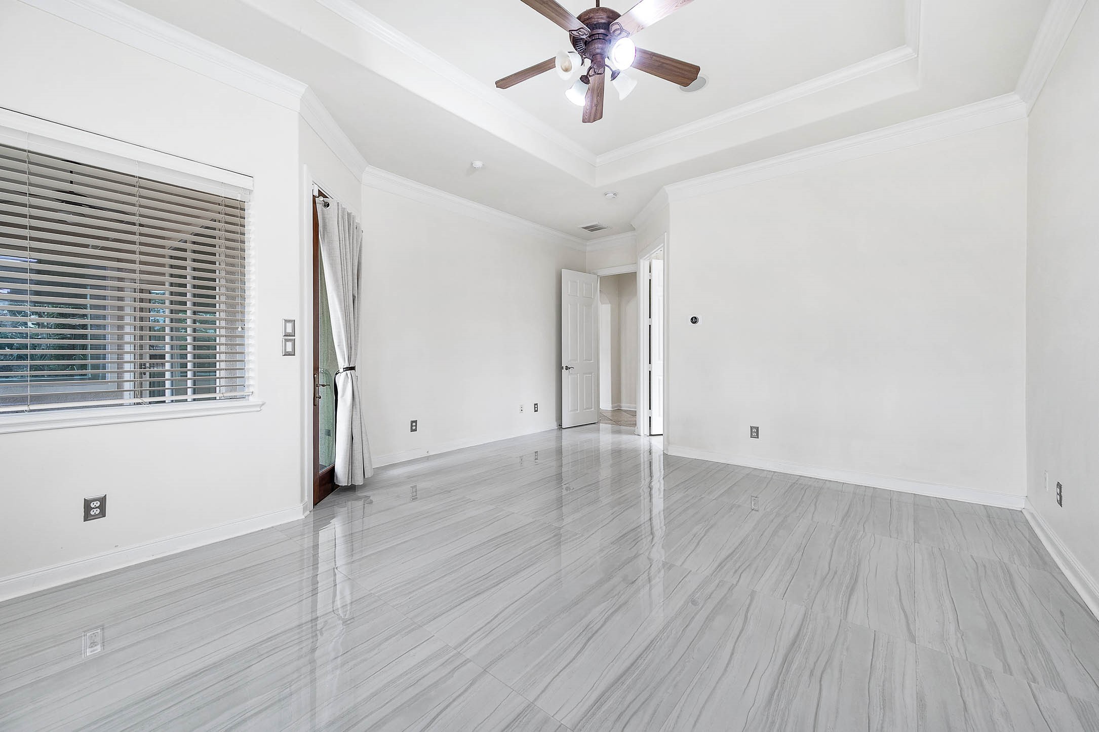 3323 Louvre Lane Houston, TX 77082 - Photo 31 of 50 an empty room with wooden floor and windows