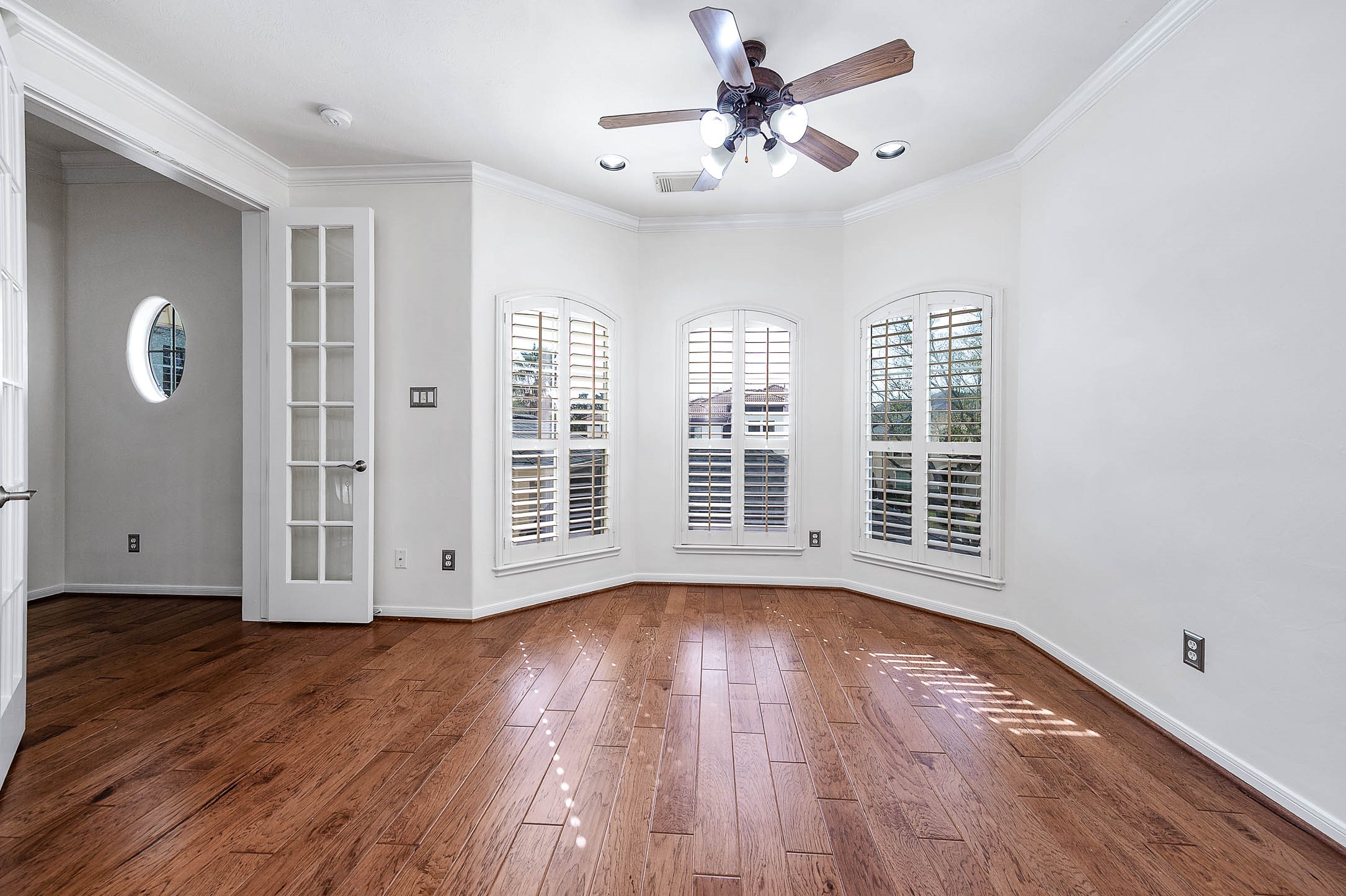3323 Louvre Lane Houston, TX 77082 - Photo 37 of 50 a view of an empty room with wooden floor and a window