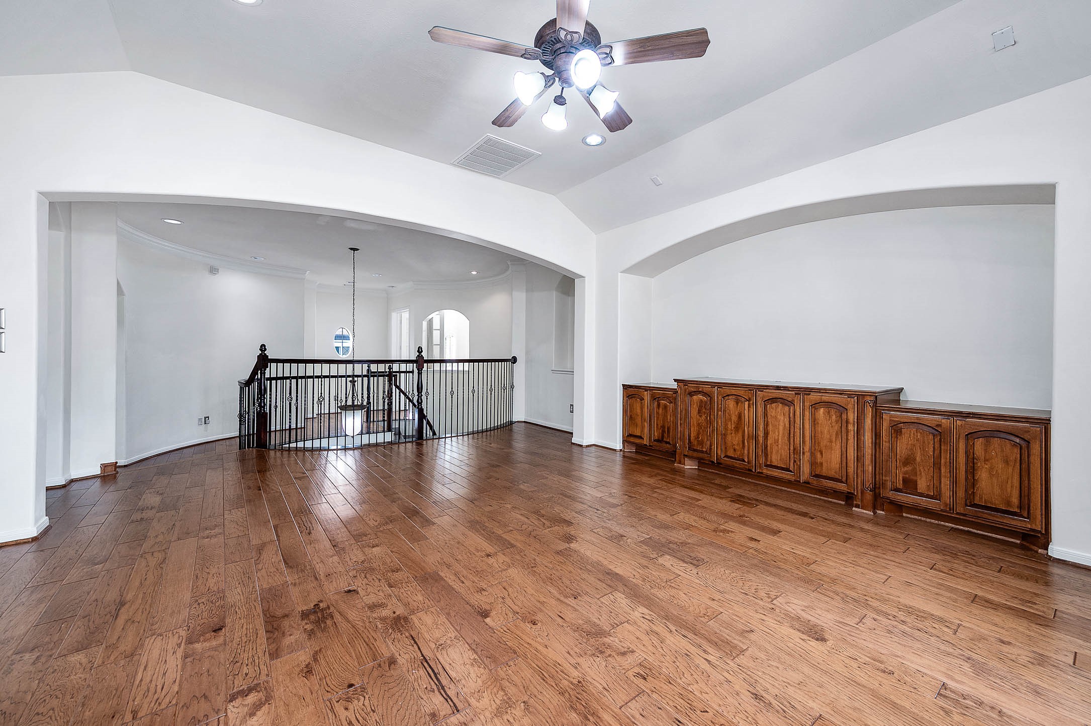 3323 Louvre Lane Houston, TX 77082 - Photo 40 of 50 a view of a livingroom with wooden floor and a ceiling fan