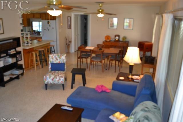 1724 Ardmore Road Fort Myers, FL 33901 - Photo 12 of 25 a living room with furniture dining table and a chandelier