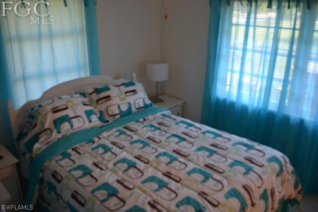 1724 Ardmore Road Fort Myers, FL 33901 - Photo 17 of 25 a bedroom with a bed with window