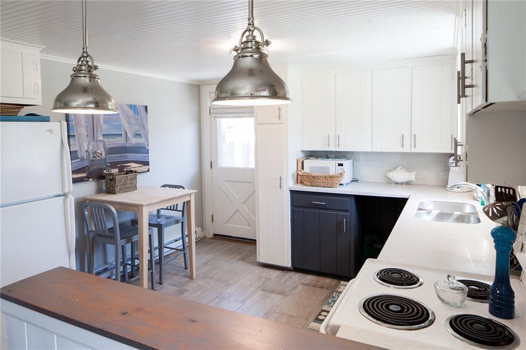 29 Cable Street Wells, ME 04090 - Photo 8 of 34 The kitchen has room for a bistro...