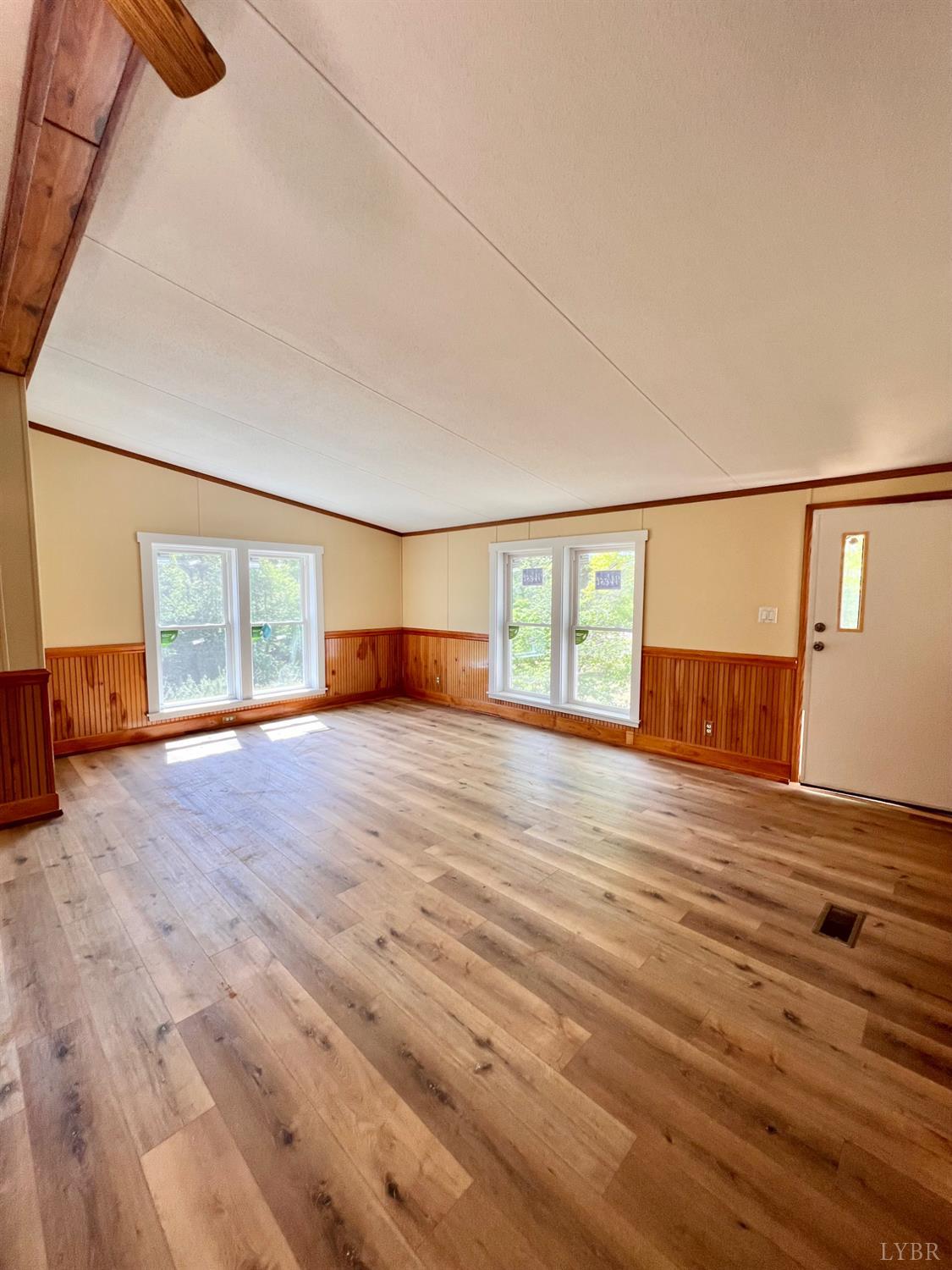 2107 Boxwood Farm Road Amherst, VA 24521 - Photo 14 of 33 a view of empty room with wooden floor and fan