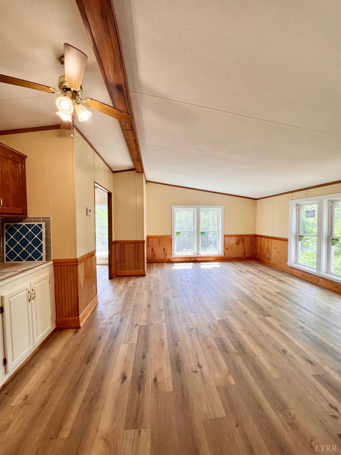 2107 Boxwood Farm Road Amherst, VA 24521 - Photo 15 of 33 a view of empty room with wooden floor and fan