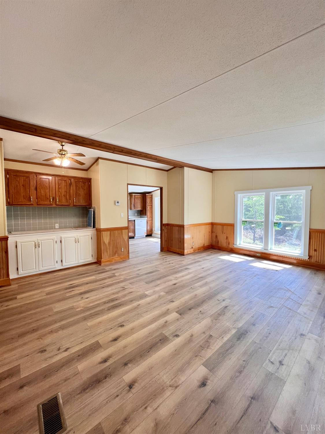 2107 Boxwood Farm Road Amherst, VA 24521 - Photo 16 of 33 a view of empty room with wooden floor and windows