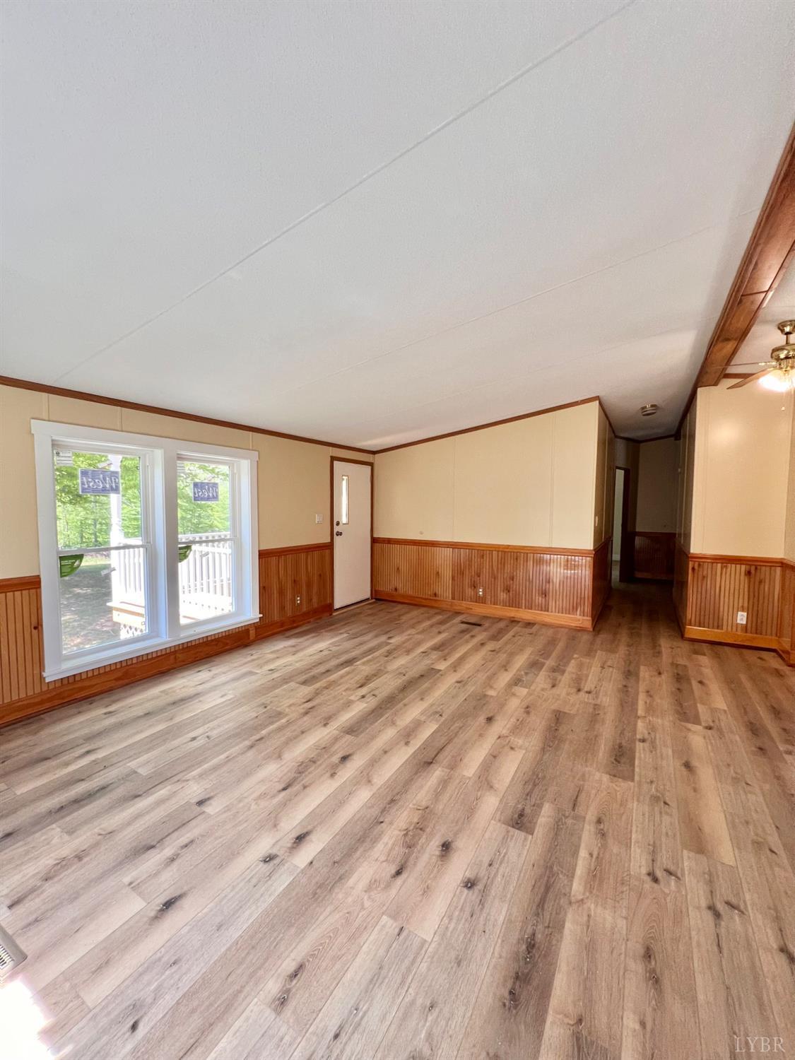 2107 Boxwood Farm Road Amherst, VA 24521 - Photo 18 of 33 a view of empty room with wooden floor and fan