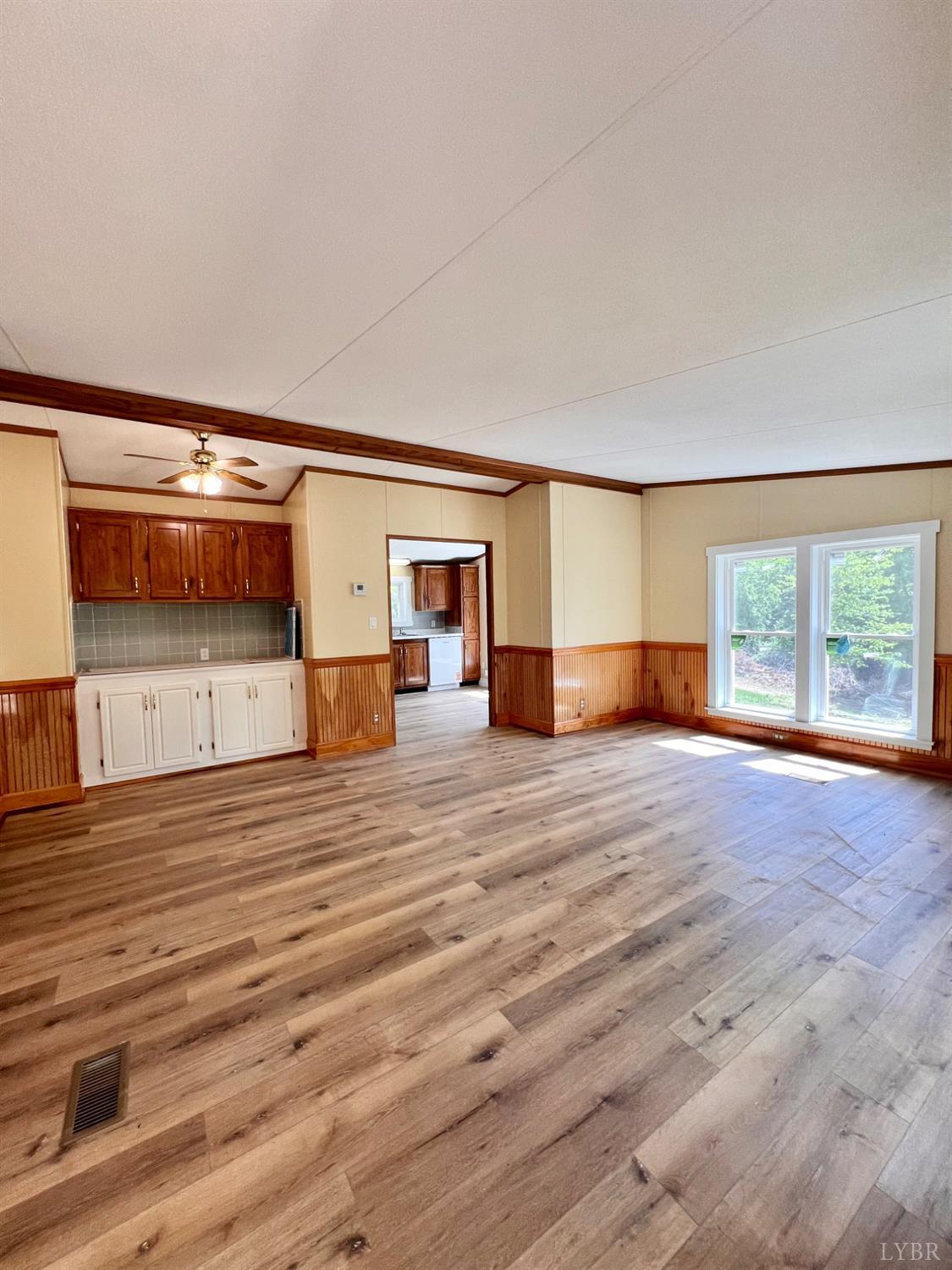 2107 Boxwood Farm Road Amherst, VA 24521 - Photo 19 of 33 a view of empty room with wooden floor and fan