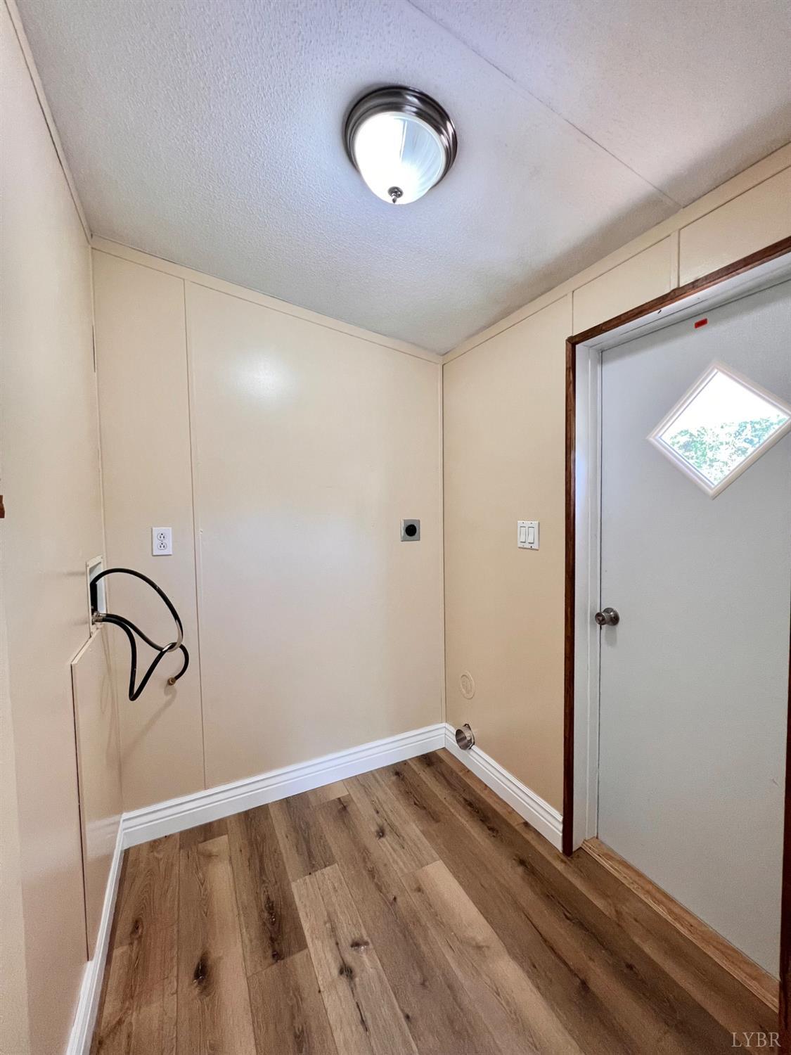 2107 Boxwood Farm Road Amherst, VA 24521 - Photo 20 of 33 a view of an empty room with wooden floor
