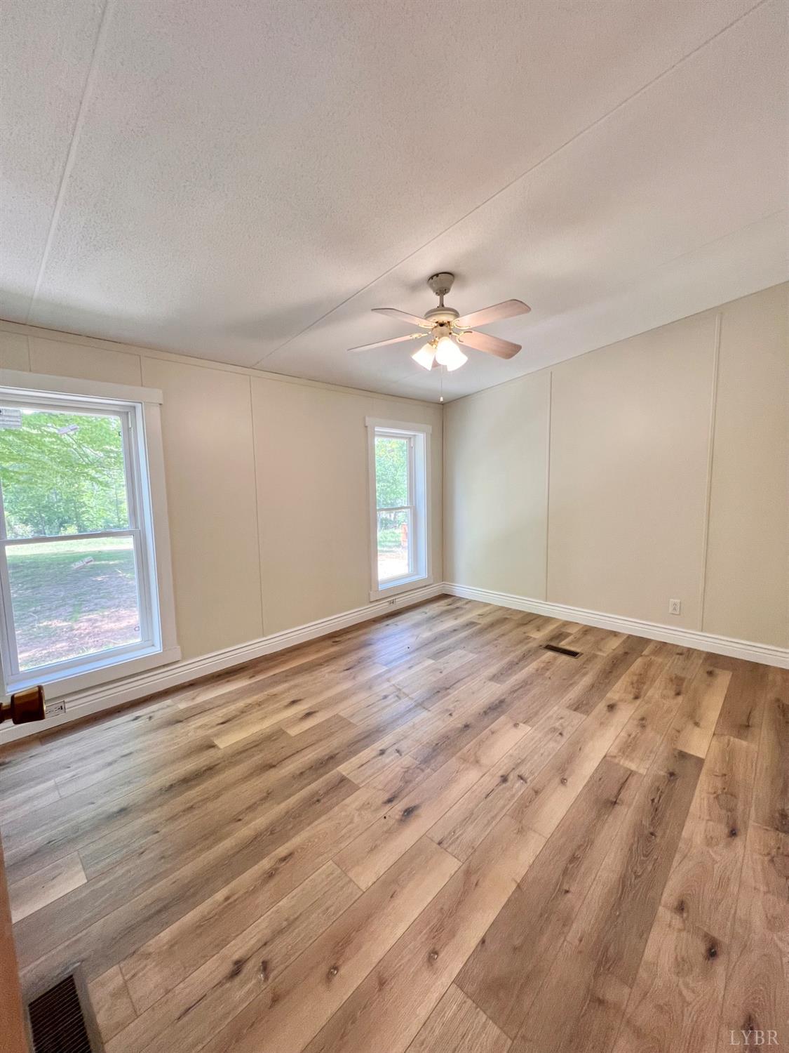 2107 Boxwood Farm Road Amherst, VA 24521 - Photo 10 of 33 a view of an empty room with window and wooden floor