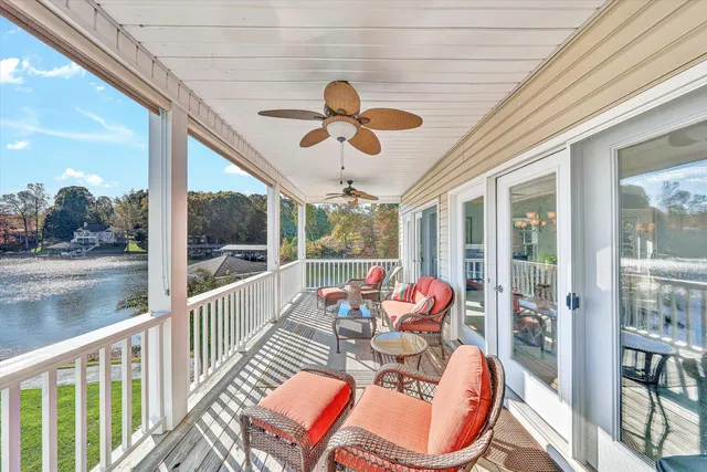 a living room with a bed furniture and a large window