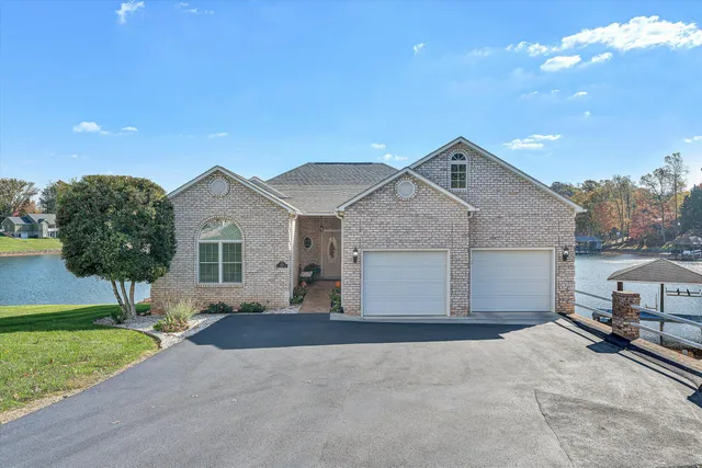 a front view of a house with swimming pool and porch