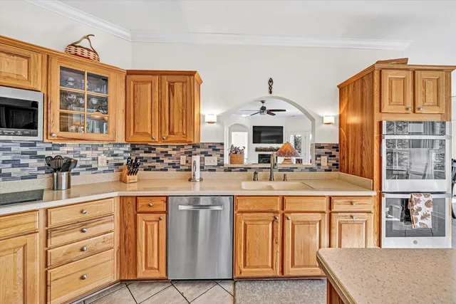 a living room with furniture fireplace and a window