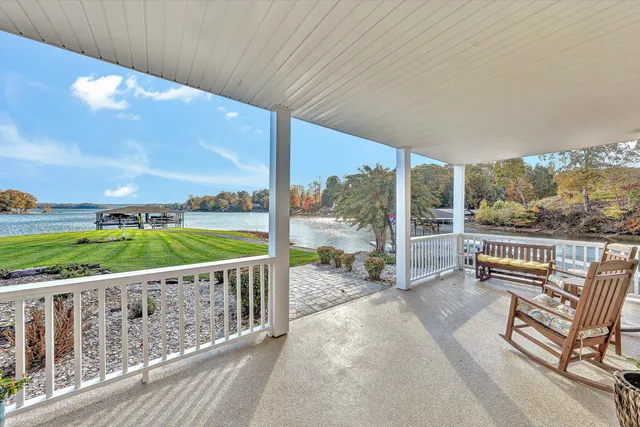 a view of a house with a yard and a patio
