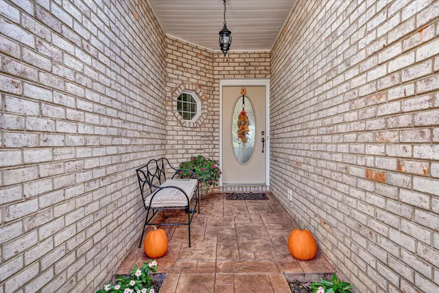 a bathroom with a granite countertop sink a toilet and a bathtub