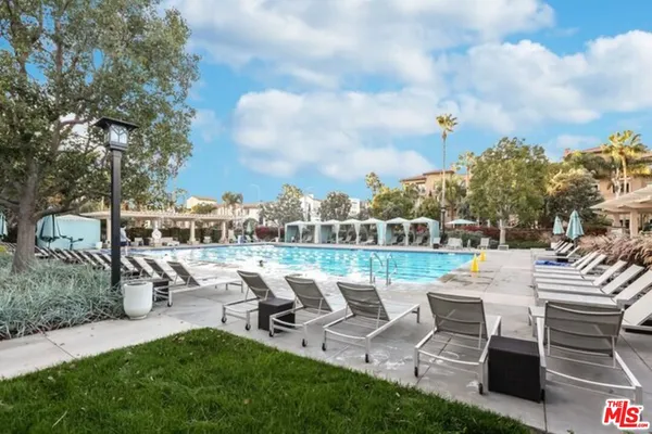 a view of a patio with chairs and a table