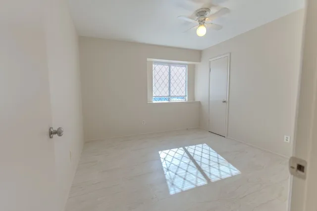 a bathroom with a toilet and a bathtub