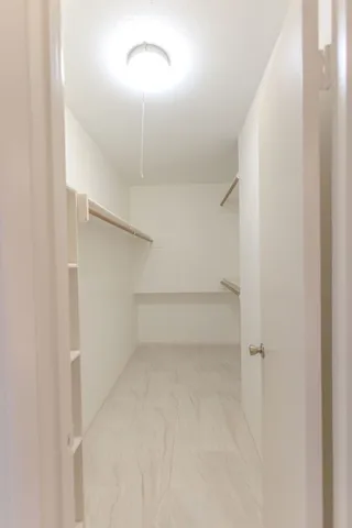 a bathroom with a double vanity sink mirror and