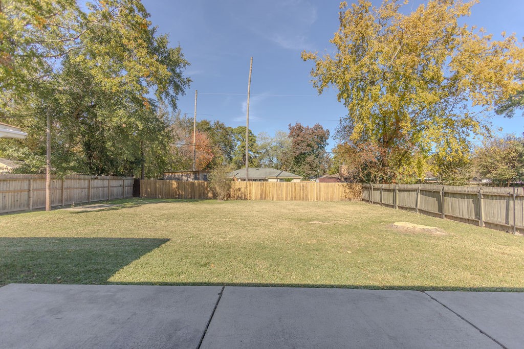 9806 Cane Creek Drive Houston, TX 77070 - Photo 20 of 28 a view of a yard with an outdoor space