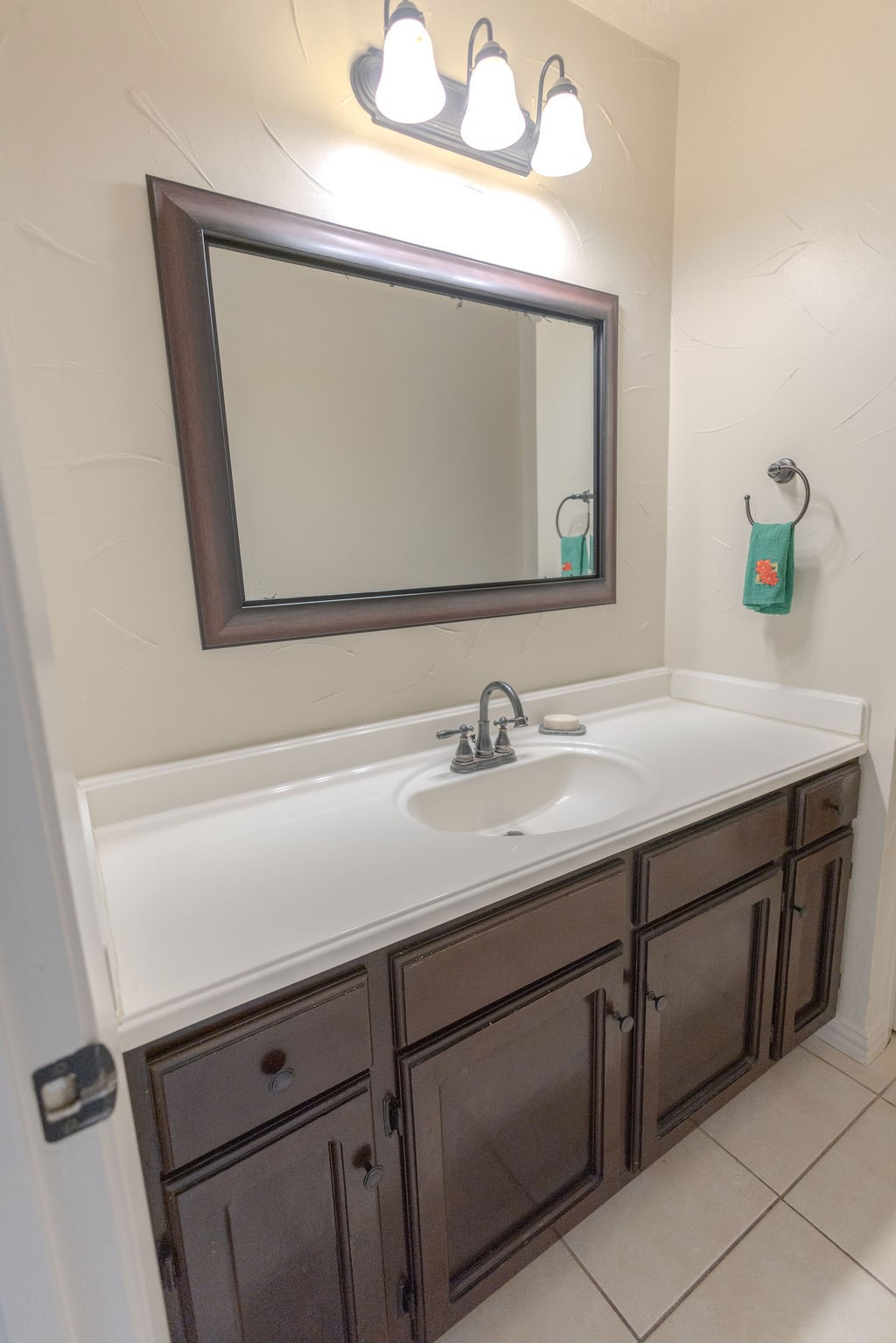 9806 Cane Creek Drive Houston, TX 77070 - Photo 24 of 28 a bathroom with a sink and a mirror