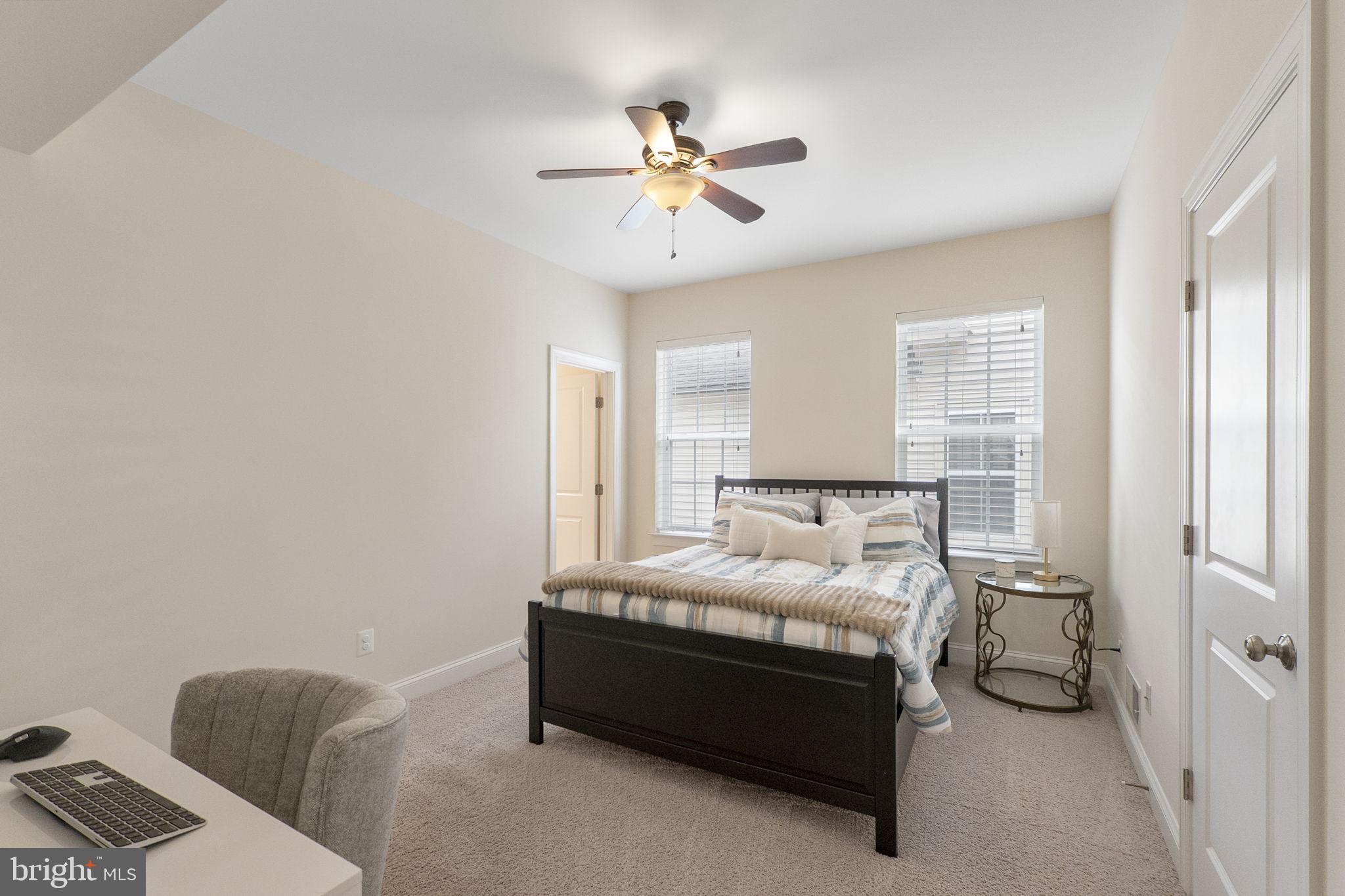 23902 Grapevine Ridge Terrace Clarksburg, MD 20871 - Photo 19 of 44 a bed room with a bed and a ceiling fan