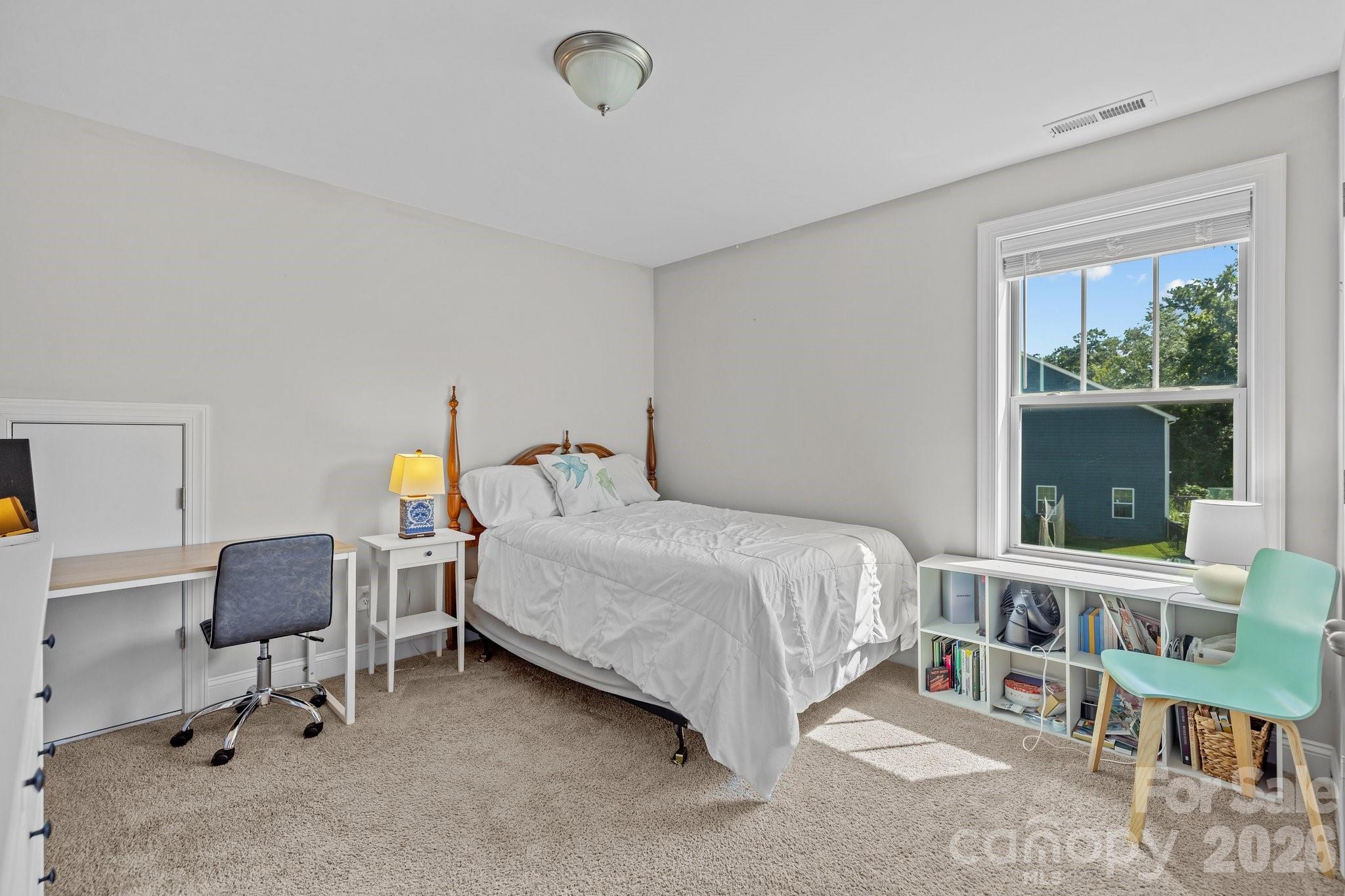 4697 Rinaldo Road York, SC 29745 - Photo 26 of 37 a bedroom with a bed and a window