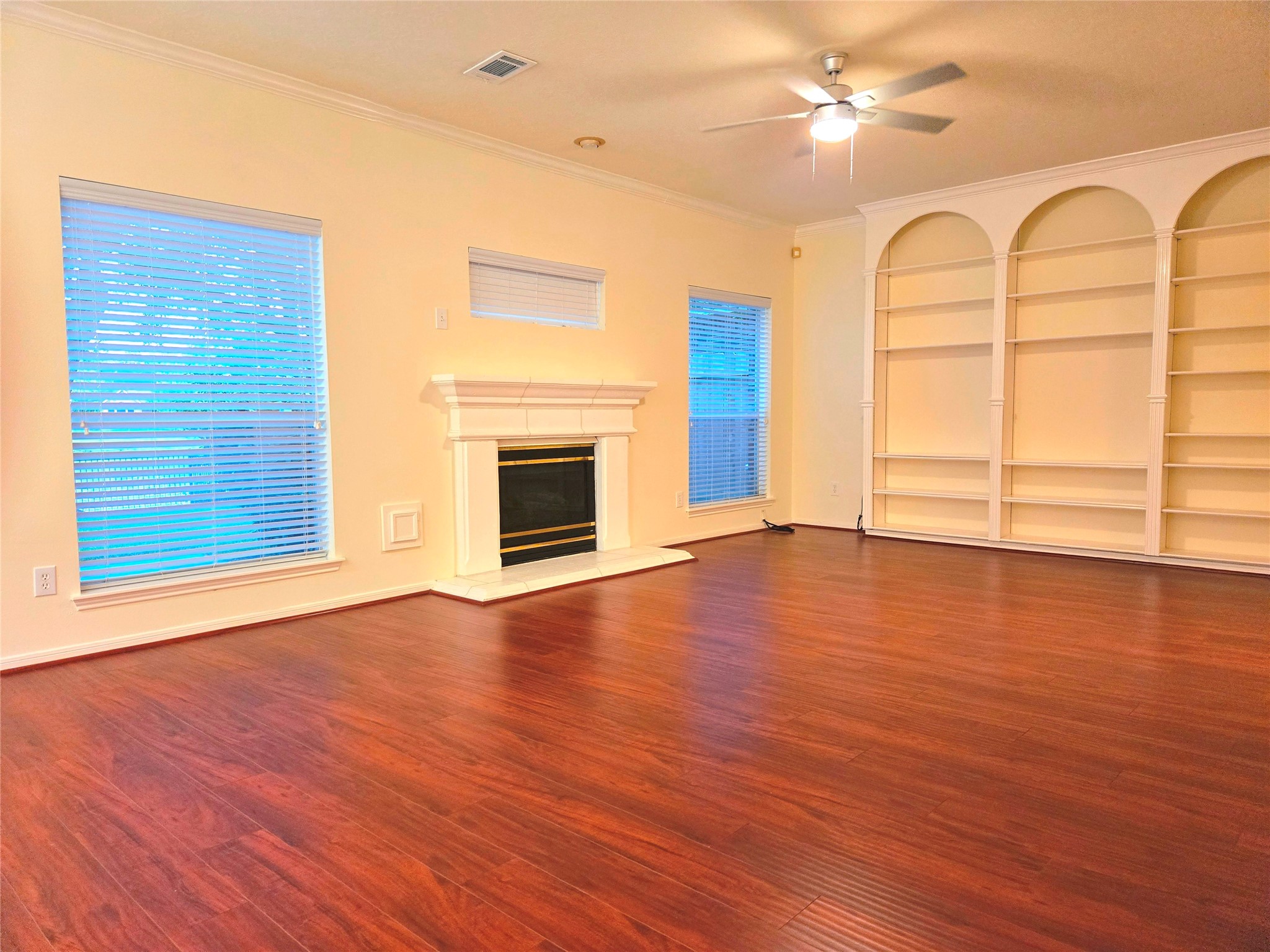 3138 Waters Way Drive Sugar Land, TX 77478 - Photo 12 of 42 a view of an empty room with wooden floor and a window