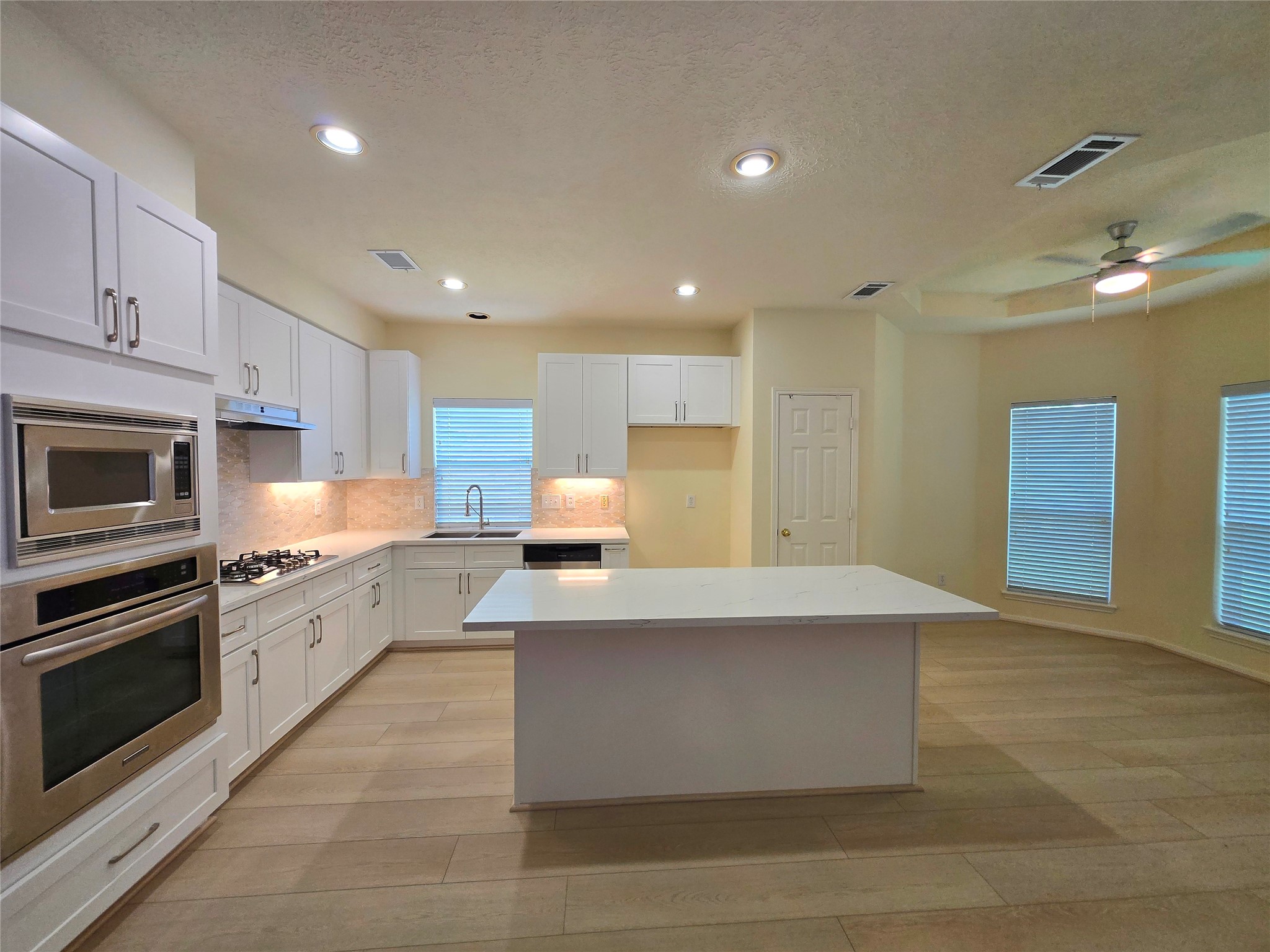 3138 Waters Way Drive Sugar Land, TX 77478 - Photo 17 of 42 a large kitchen with stainless steel appliances lots of counter space and a sink