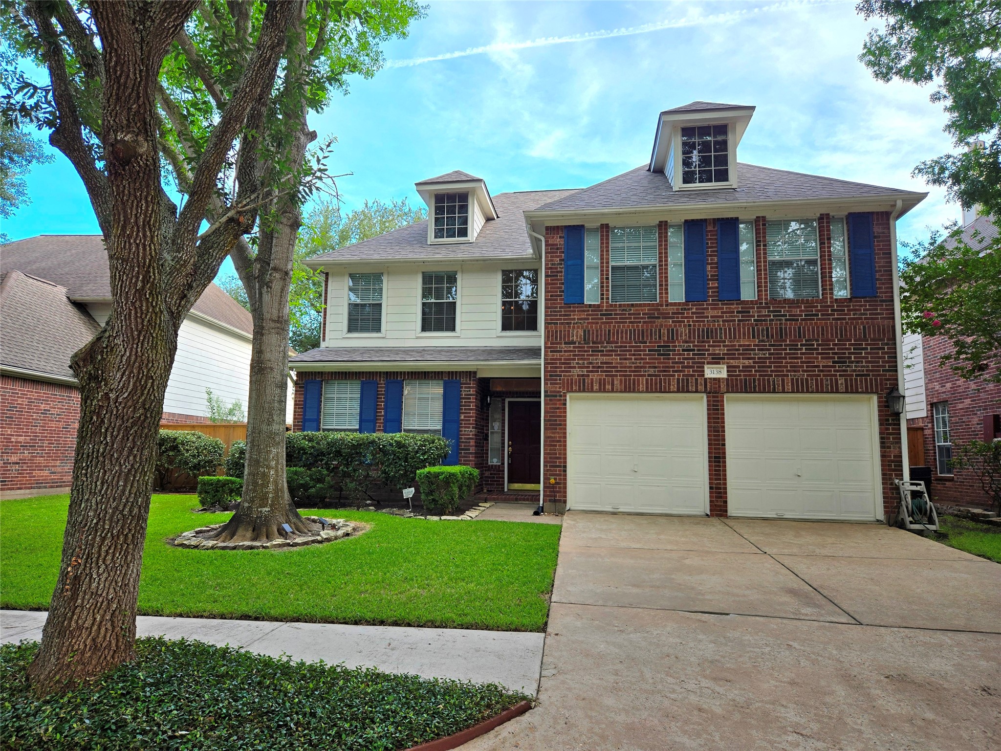 3138 Waters Way Drive Sugar Land, TX 77478 - Photo 2 of 42 a front view of a house with a garden