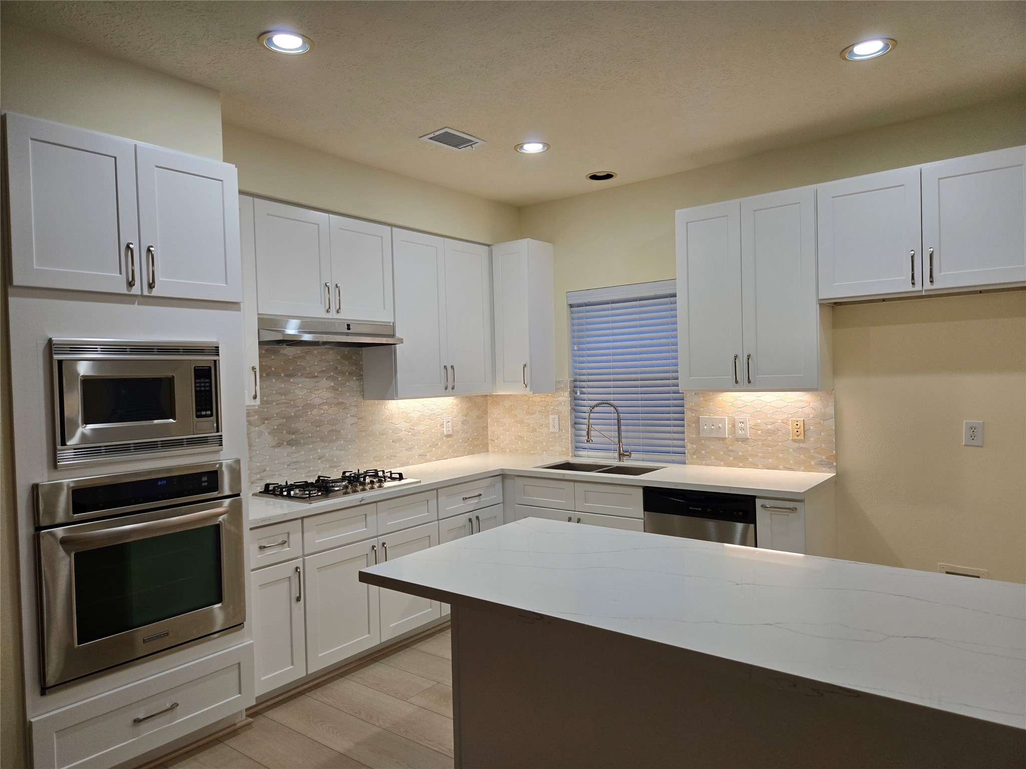 3138 Waters Way Drive Sugar Land, TX 77478 - Photo 22 of 42 a kitchen with a stove and a sink