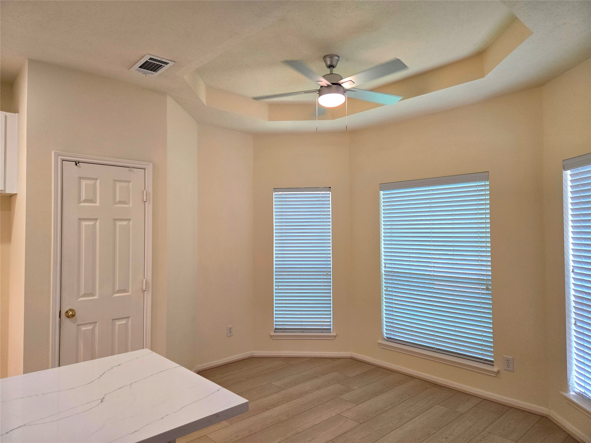 3138 Waters Way Drive Sugar Land, TX 77478 - Photo 24 of 42 a view of an empty room with wooden floor and a window