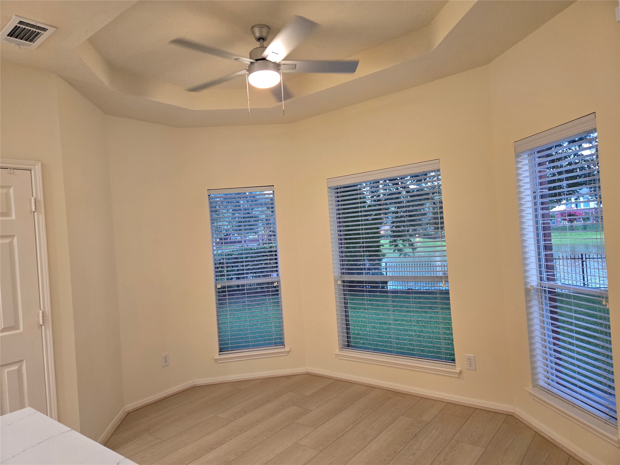 3138 Waters Way Drive Sugar Land, TX 77478 - Photo 26 of 42 a view of an empty room with a window and chandelier fan