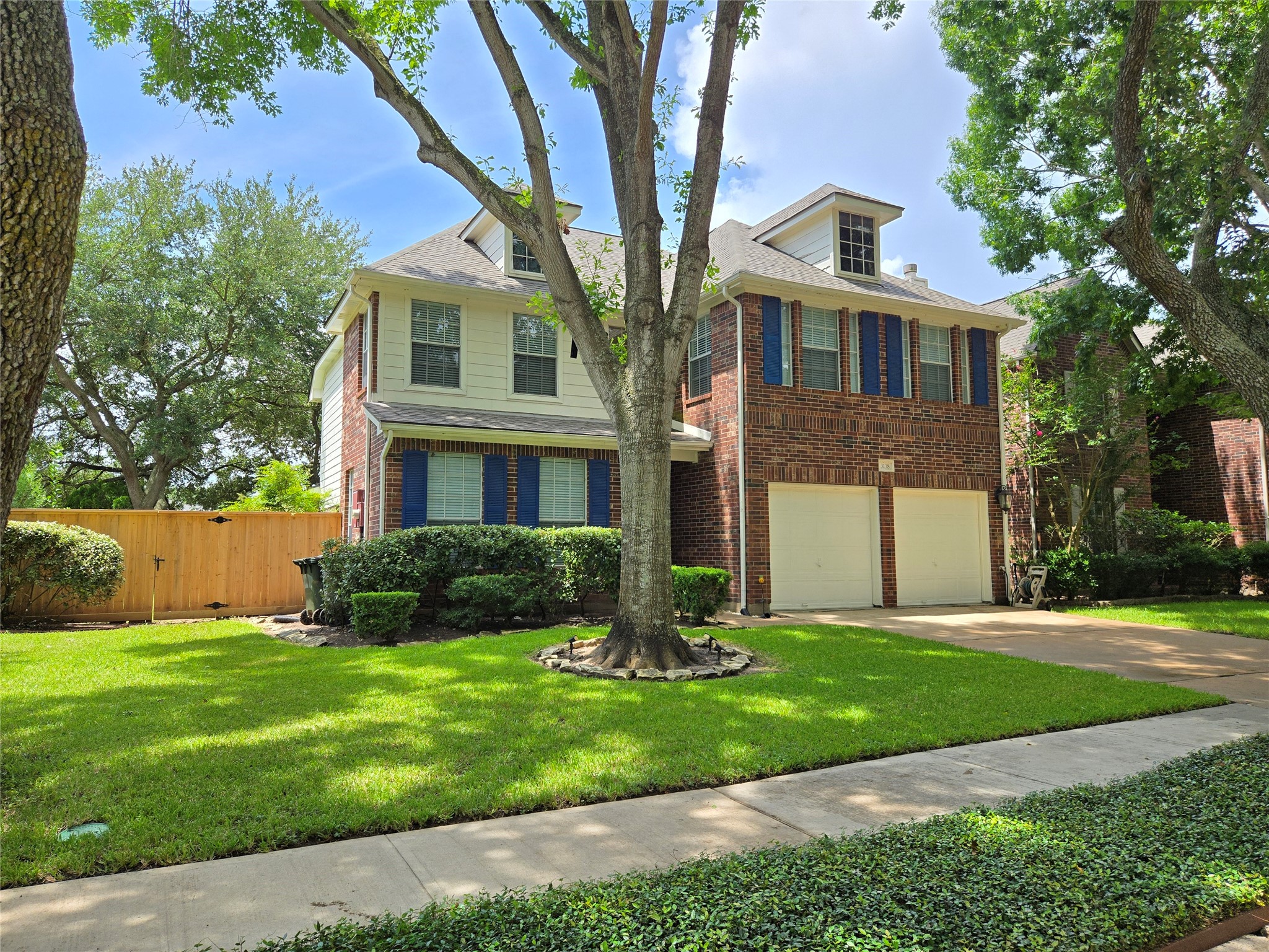 3138 Waters Way Drive Sugar Land, TX 77478 - Photo 3 of 42 a front view of a house with a yard and garage