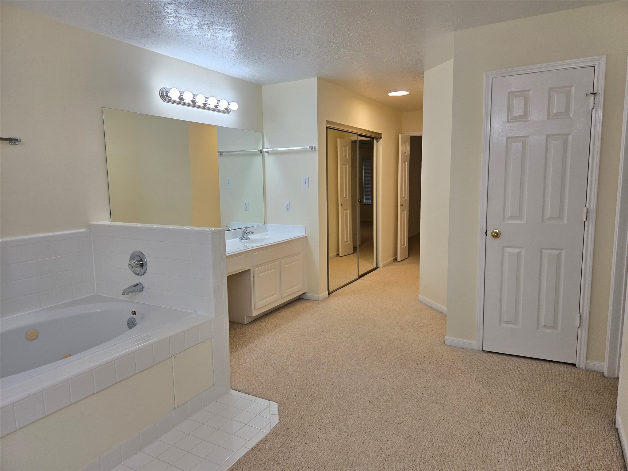 3138 Waters Way Drive Sugar Land, TX 77478 - Photo 32 of 42 a spacious bathroom with a bathtub and a shower