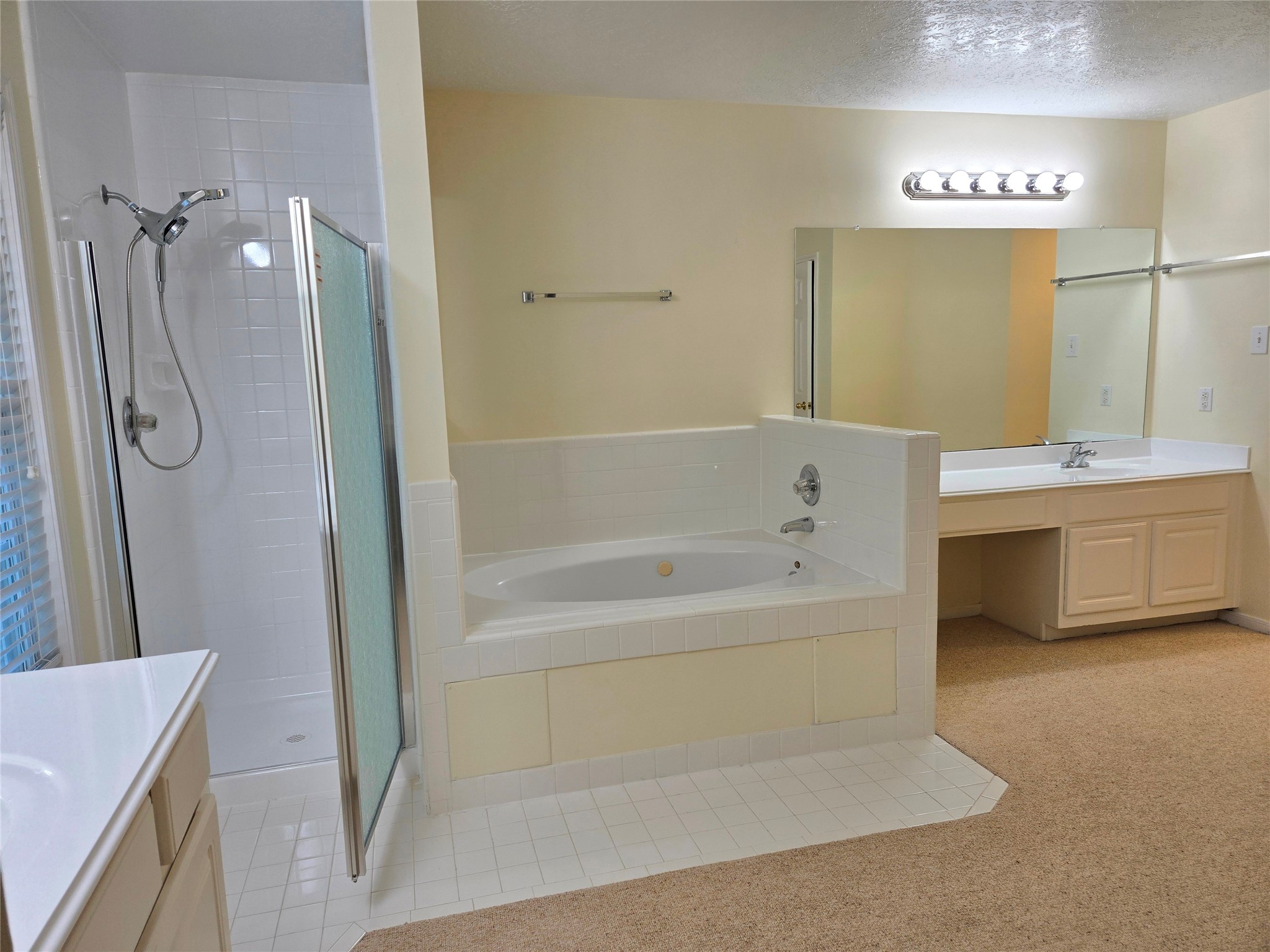 3138 Waters Way Drive Sugar Land, TX 77478 - Photo 34 of 42 a bathroom with a tub sink shower and mirror