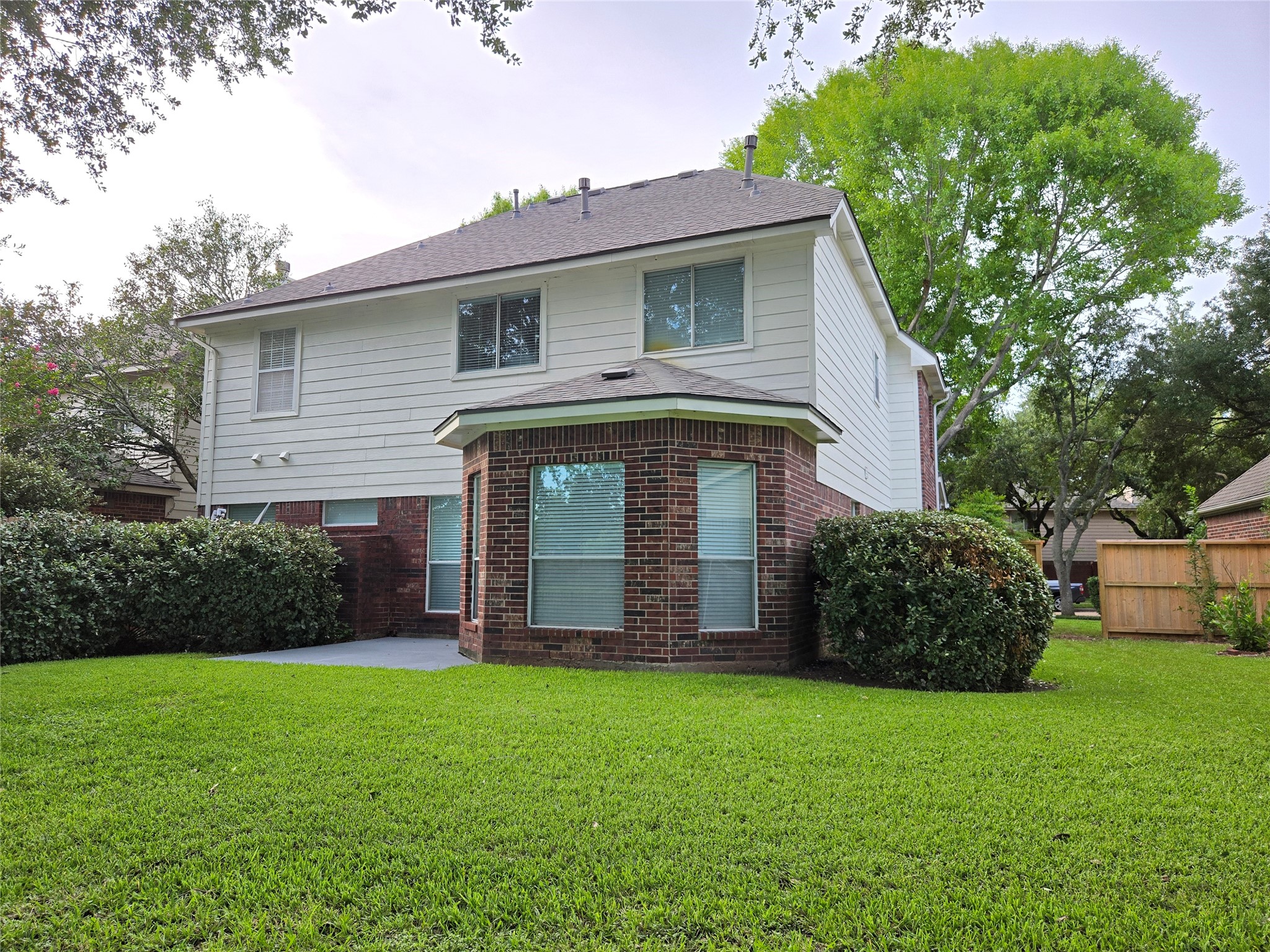 3138 Waters Way Drive Sugar Land, TX 77478 - Photo 4 of 42 a front view of a house with a garden