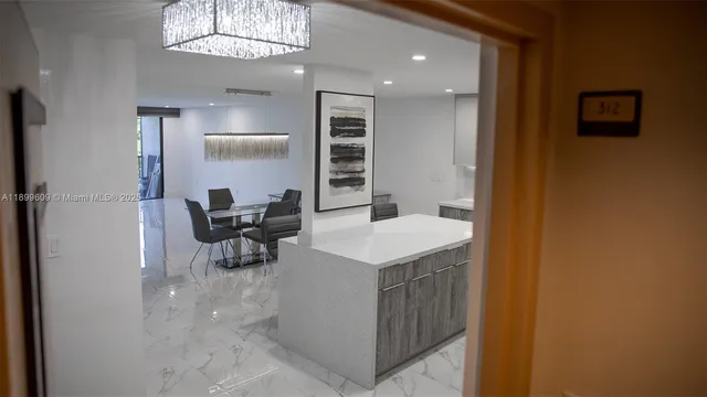a view of kitchen island with cabinets and wooden floor