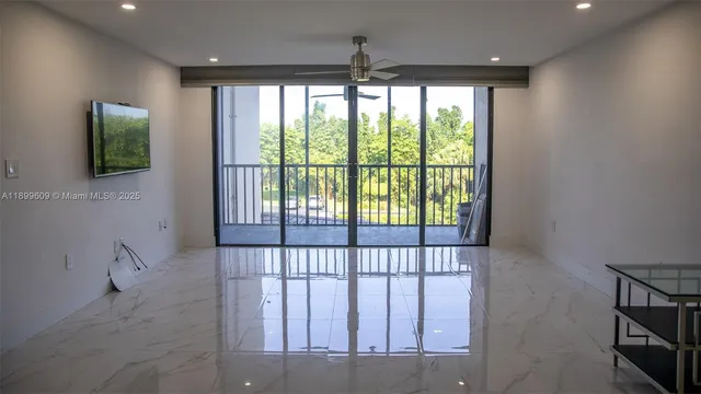 a view of a hallway with a window
