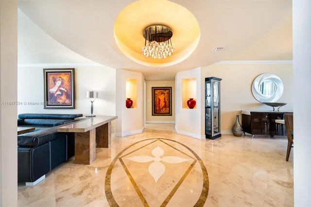 a view of a kitchen with kitchen island stainless steel appliances wooden floor and a counter top space