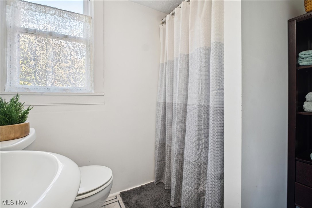 13930 Carter Road Wakeman, OH 44889 - Photo 26 of 45 Bathroom with toilet and tile patterned floors